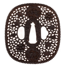 Iron Nanban School Tsuba Decorated with Dragon, Plum Blossom and Umebachi Kamon