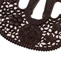 Iron Nanban School Tsuba Decorated with Dragon, Plum Blossom and Umebachi Kamon